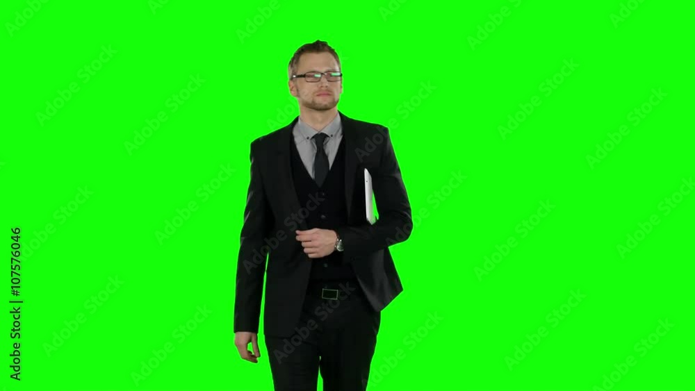 Business man walking and use laptop. Green screen. Business man walking and use laptop. Green screen.