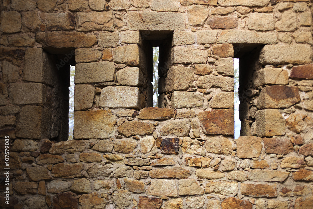 Three window holes on a medieval rock fortress