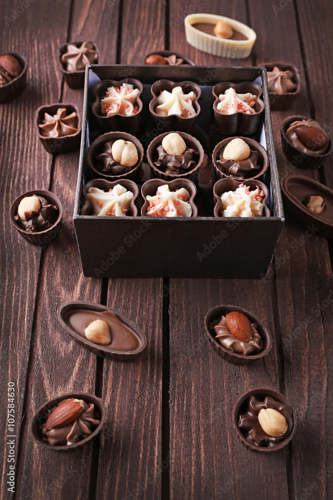 Chocolate sweets on wooden background Chocolate sweets on wooden background