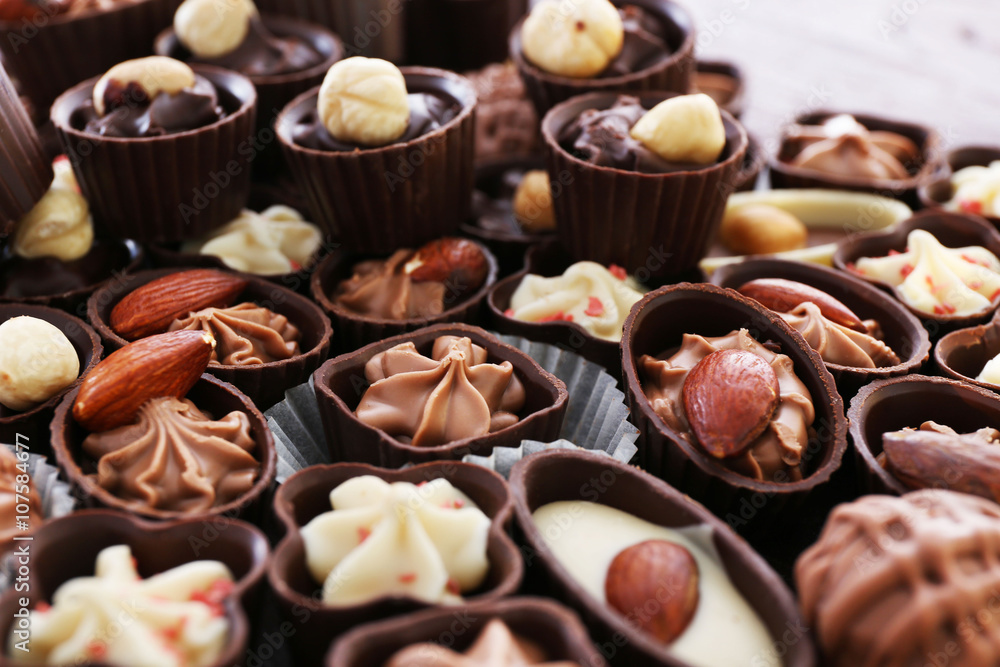 Delicious chocolate candies background, close up Delicious chocolate candies background, close up