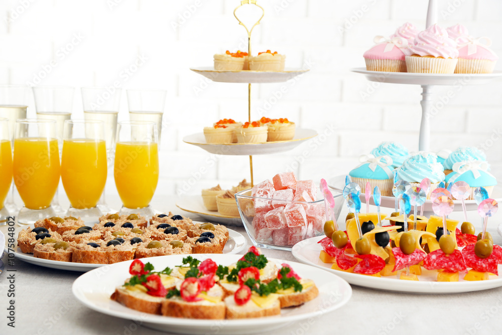 Set of cold snacks, canape, beverages and dessert, closeup