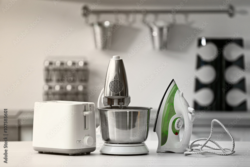 Household and kitchen appliances on the table in kitchen Household and kitchen appliances on the table in kitchen