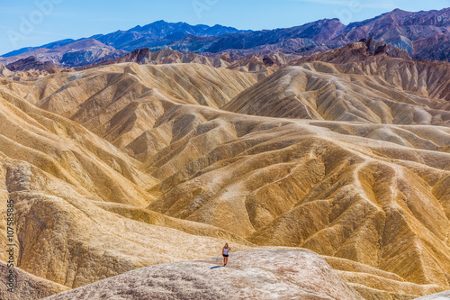 Erosional landscape of hills composed of sediments from Furnace Creek Lake, which dried up 5 million years ago. Wide view of landscape sand dunes. Beautiful view over Zabriskie point, Death Valley