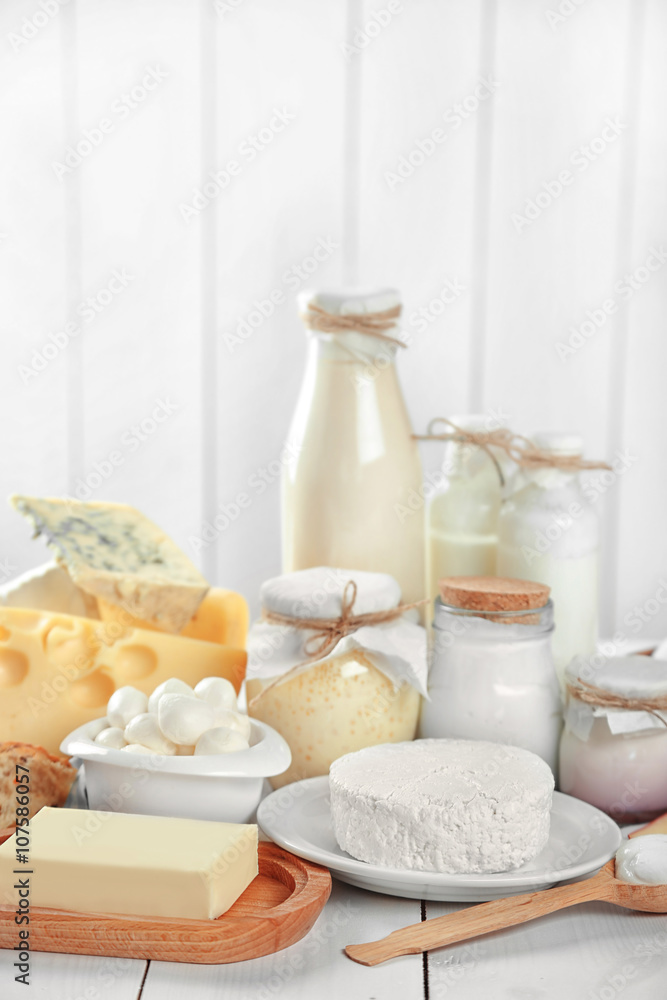 Set of fresh dairy products on white wooden table Set of fresh dairy products on white wooden table