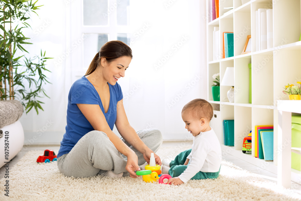 Happy smiling family playing with toys Happy smiling family playing with toys
