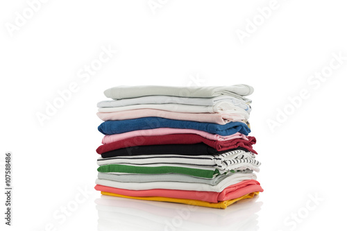 Pile of colorful clothes and Beautiful summer isolated on white