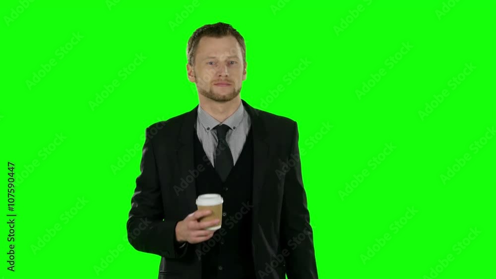 Businessman walking and drink coffee. Green screen Businessman walking and drink coffee. Green screen