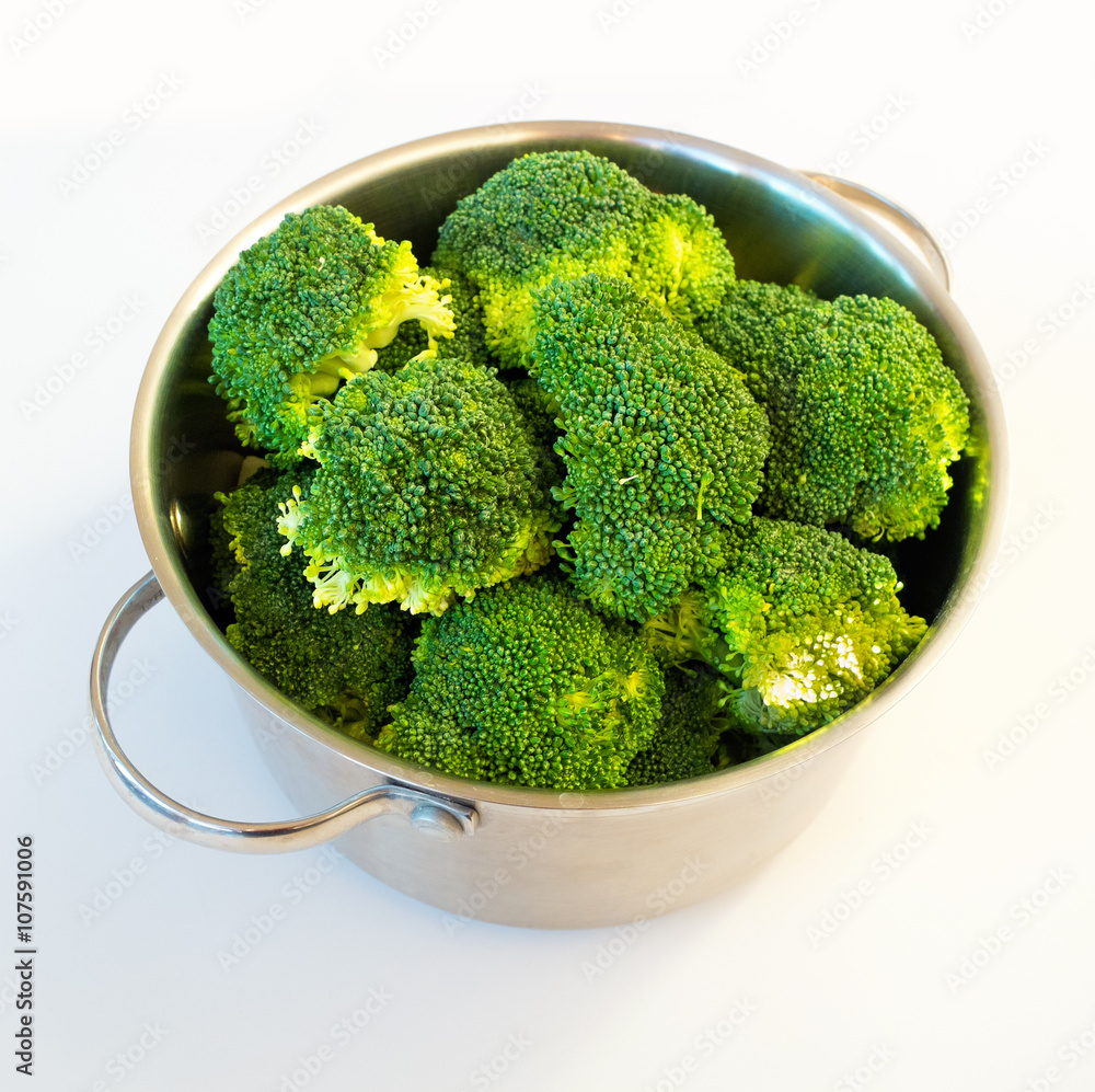 Fresh raw broccoli in casserole dish, isolated Fresh raw broccoli in casserole dish, isolated