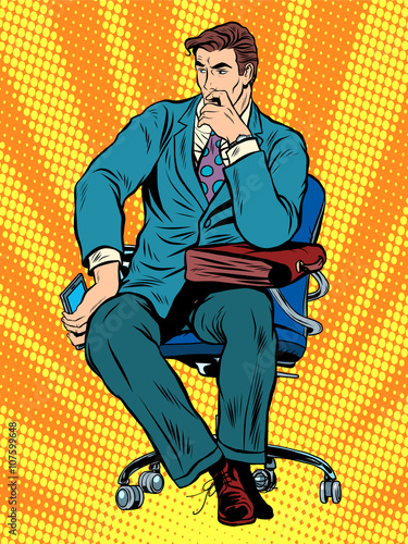 thoughtful businessman sitting in chair