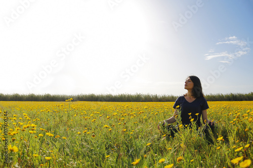 Sunset silhouette of happy woman