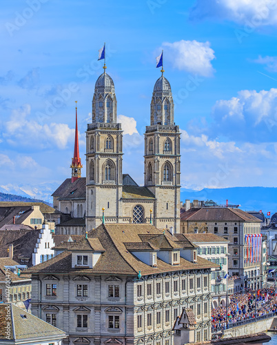 Towers of the Grossmunster decorated with flags of Zurich
