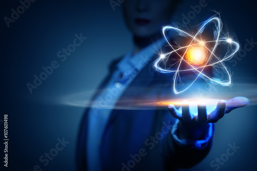 Atom molecule in female hand