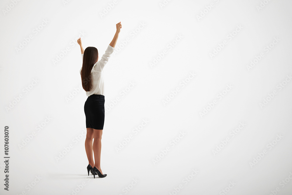 Girl with long hair rising her hands up Girl with long hair rising her hands up