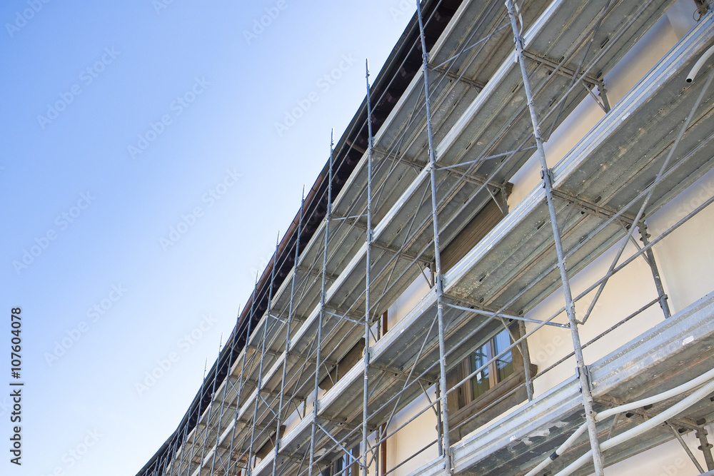 Metal scaffolding for the restoration of a building in a italian construction site