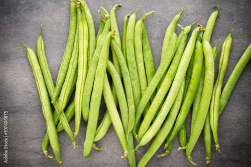 Green beans  on a gray background.
