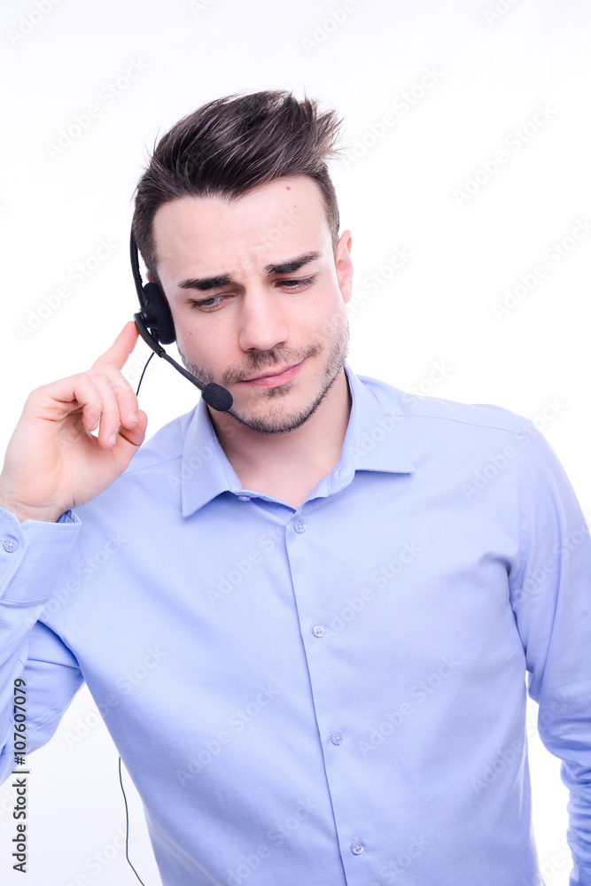 handsome young man hotline call center service operator on phone call with a customer handsome young man hotline call center service operator on phone call with a customer