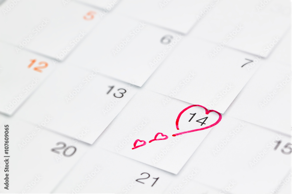Date of February 14 Valentine's Day red heart encircled on calendar Date of February 14 Valentine's Day red heart encircled on calendar