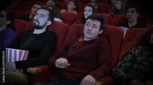 Man speening at cinema photo