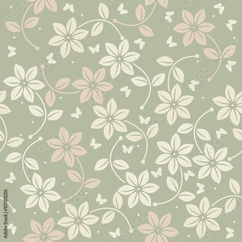 Spring seamless pattern with flowers and butterflies on green ba