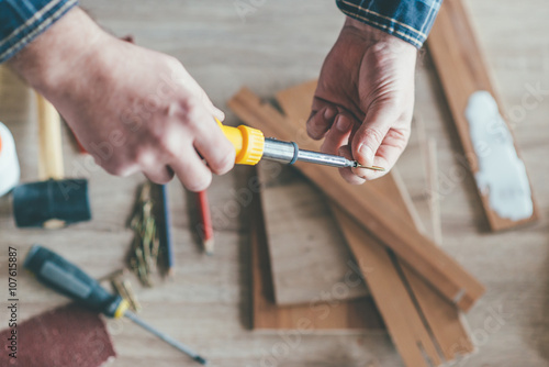 Carpenter holding a screwdriver