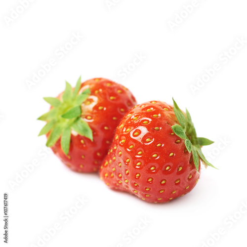Pair of red strawberries isolated