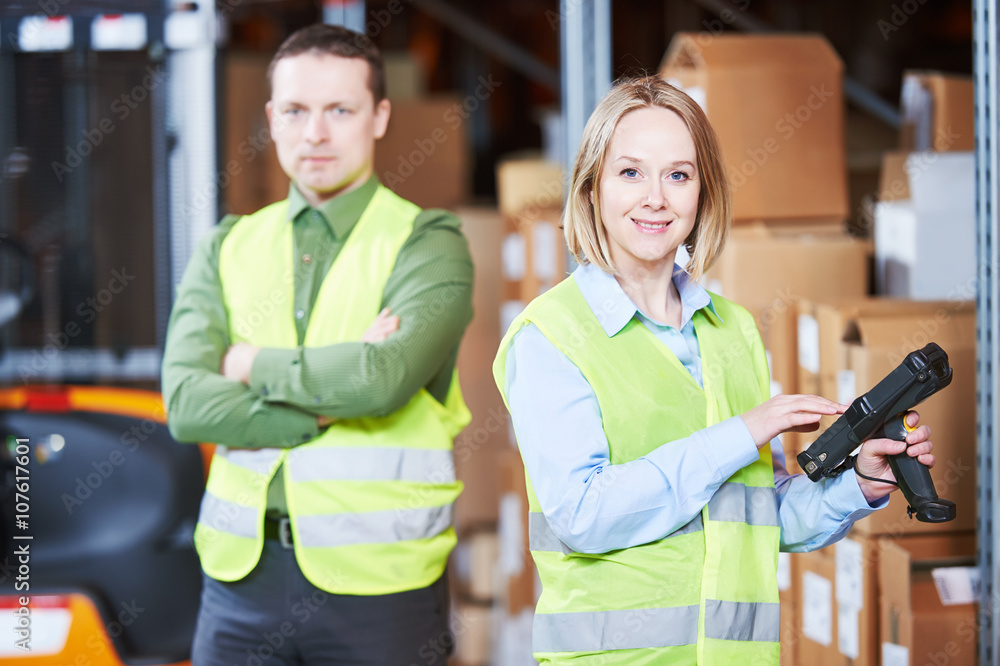 Warehouse Management System. Worker with barcode scanner Warehouse Management System. Worker with barcode scanner