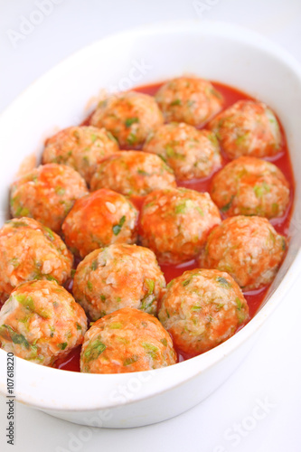 cutlets of meat and rice in tomato sauce