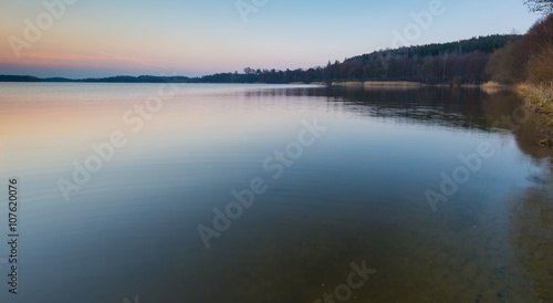 Lake at sunset in Mazury lake district in Poland