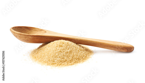 Spoon over pile of sugar