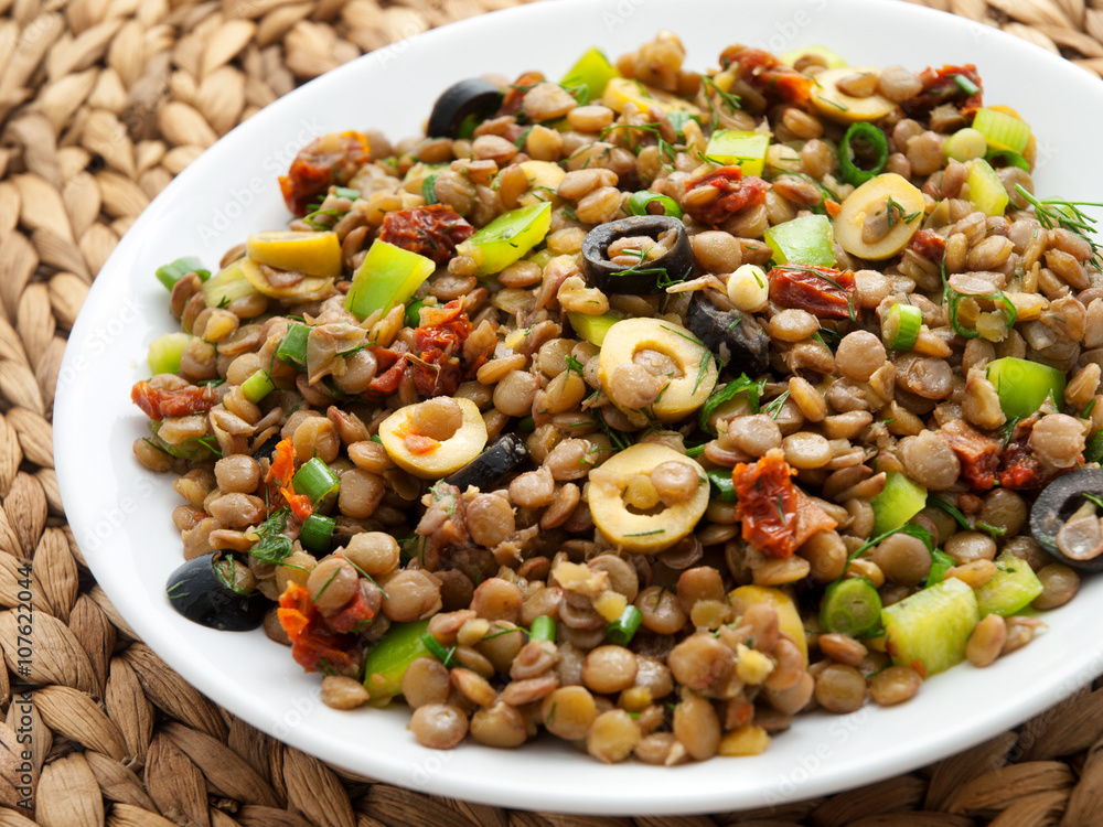Lentil salad with green peppers, dried tomatoes and olives. Horizontal shot Lentil salad with green peppers, dried tomatoes and olives. Horizontal shot