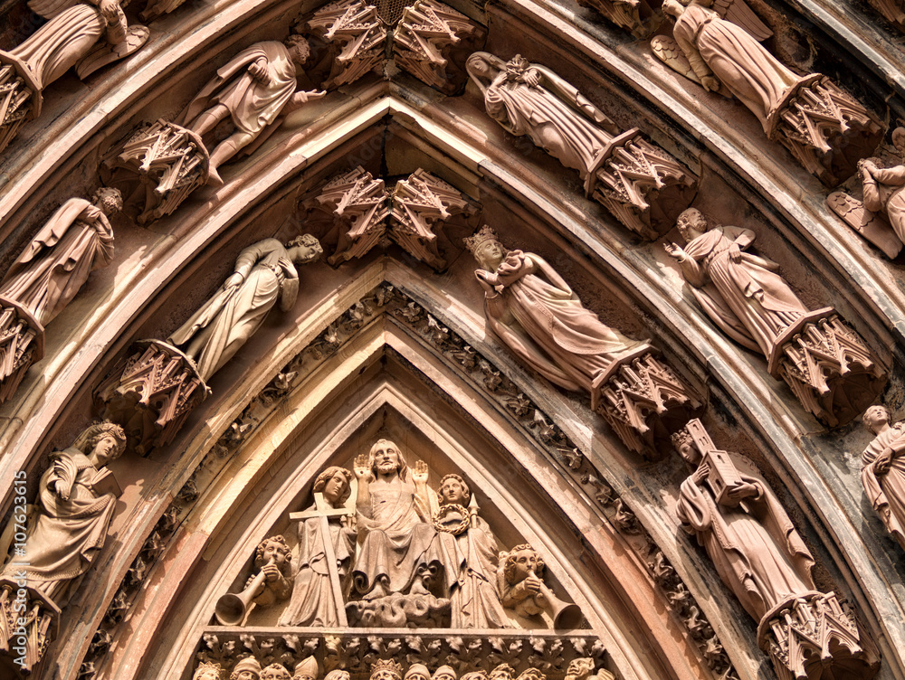 Close up of statues engraved on Strasbourg cathedral.