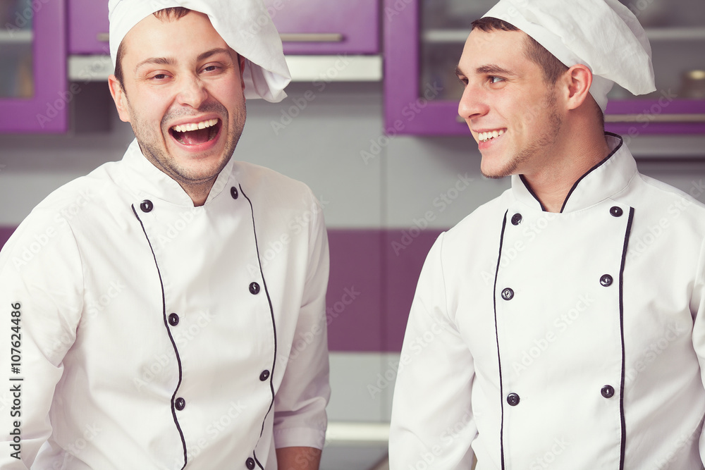 Cooking process, perfect teamwork concept. Portrait of two men