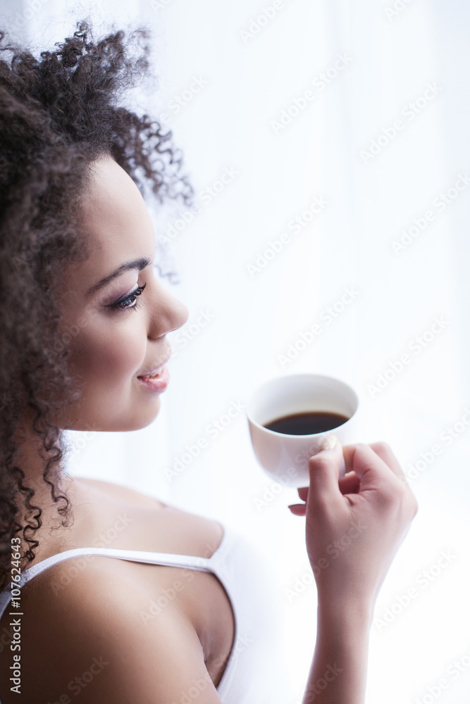 Attractive woman is enjoying hot beverage Attractive woman is enjoying hot beverage