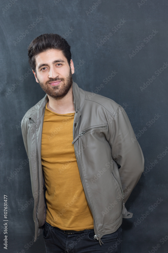 Looking cool and trendy. Handsome young bearded man posing again