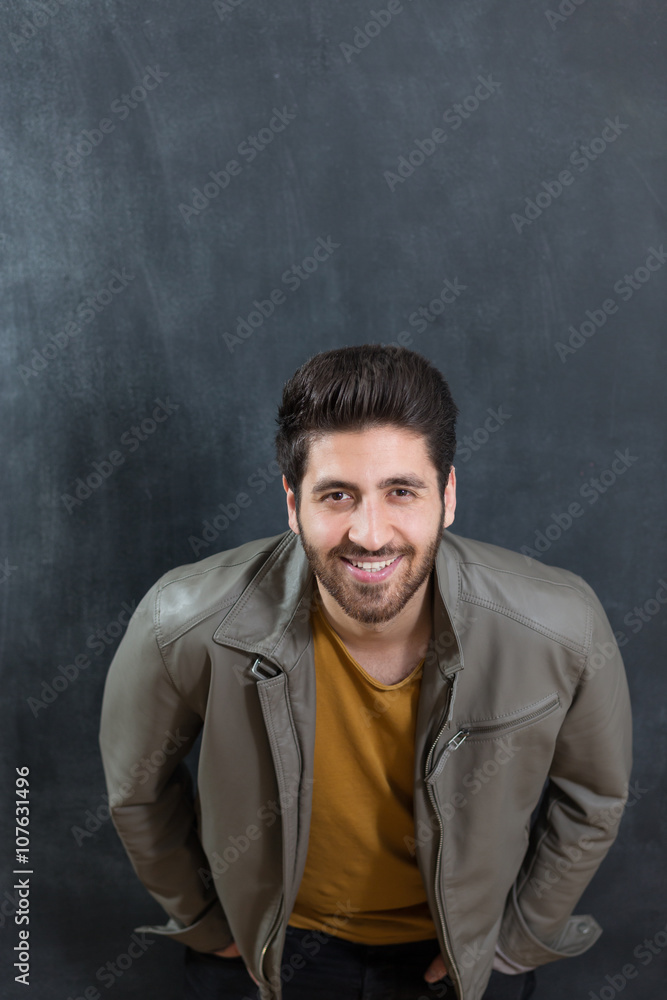 Portrait of a bearded man on chalkboard background
