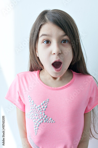 Little girl making a funny face. 