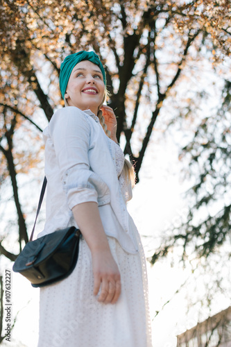 Beautiful smiling woman on nature background, spring time happin photo