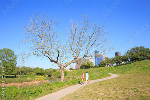 Couple is walking around under view of downtown Houston city, Te