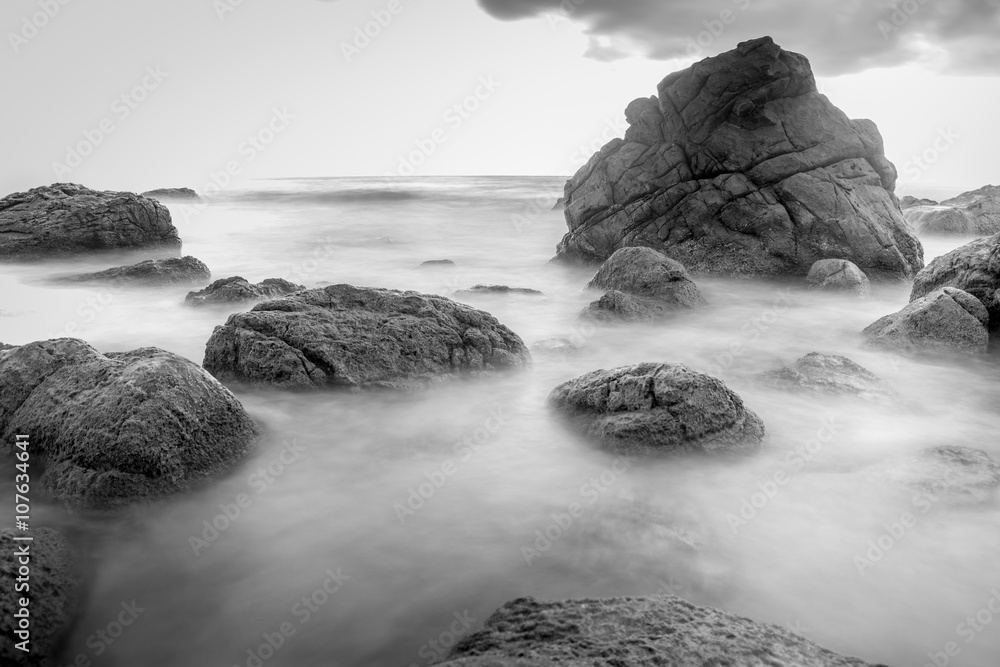 rock beach in black and white with long exposure photography