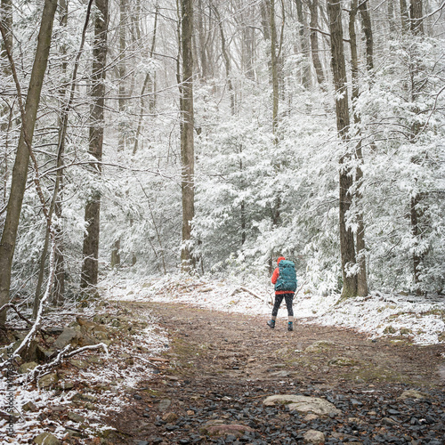 Hiker on the trail in winter