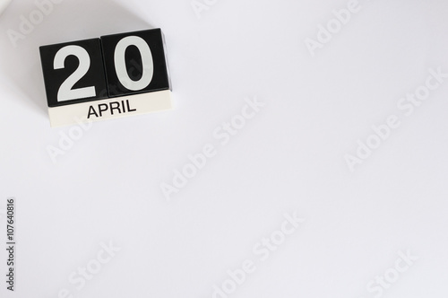 April 20th. Cannabis Day. Image of april 20 wooden color calendar on white background. Spring day, empty space for text. Secretary's DAY