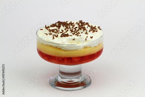 Traditional English strawberry trifle with fresh whipped cream on white background
 photo
