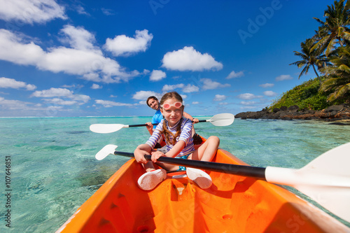 Kids kayaking in ocean