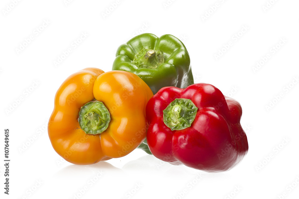 colored peppers close up over white background colored peppers close up over white background
