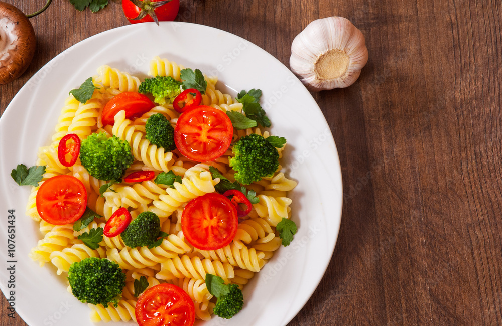 custom made wallpaper toronto digitalFusilli pasta with cherry tomatoes and broccoli in a plate on wooden table