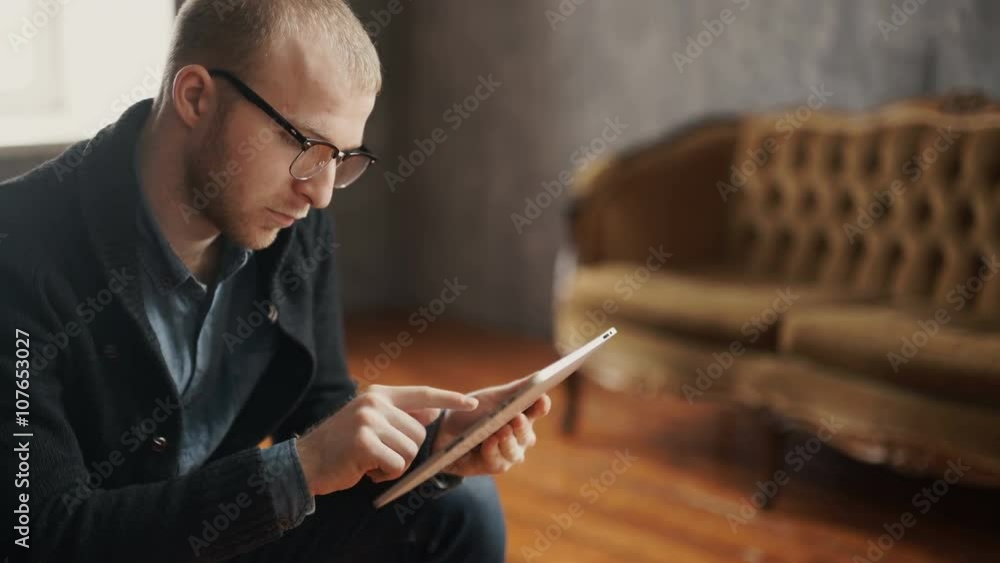 Portrait Of A Handsome Young Happy Man Using Digital Tablet Portrait Of A Handsome Young Happy Man Using Digital Tablet