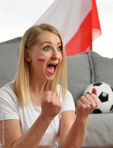 Obraz na płótnie Polish fan cheers football team in the national colors. w salonie