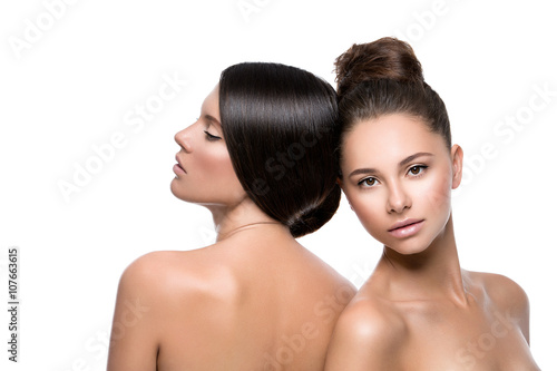 Fotografie Two beautiful girls with perfect skin
