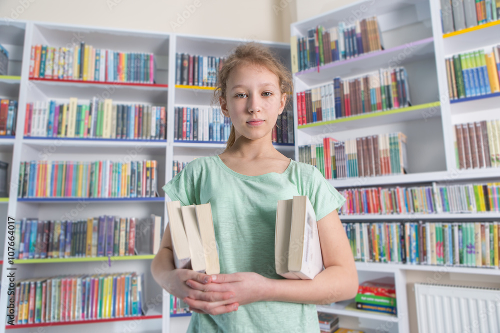 Cute girl reading book in library
Cute girl reading book in library