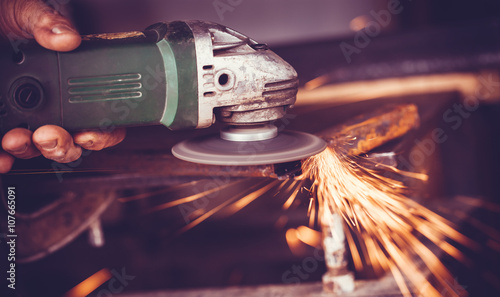 Fotografie, Tablou master of welding seams angle grinder